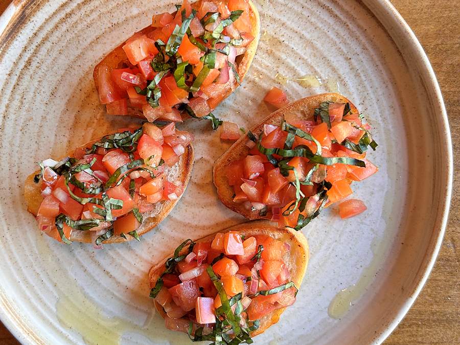 bruschetta onion, garlic, basil sunday supper club may insomnia restaurant lounge bloor toronto